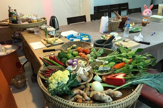 Phuket Easy Thai Cooking Class and Market Tour - Cooking in an open kitchen near Rawai