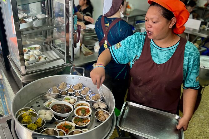 Phuket Old Town Food Tour with 10+ Locals' Favorites Tastings - Blue Elephant, temples, and Michelin Guide food stalls